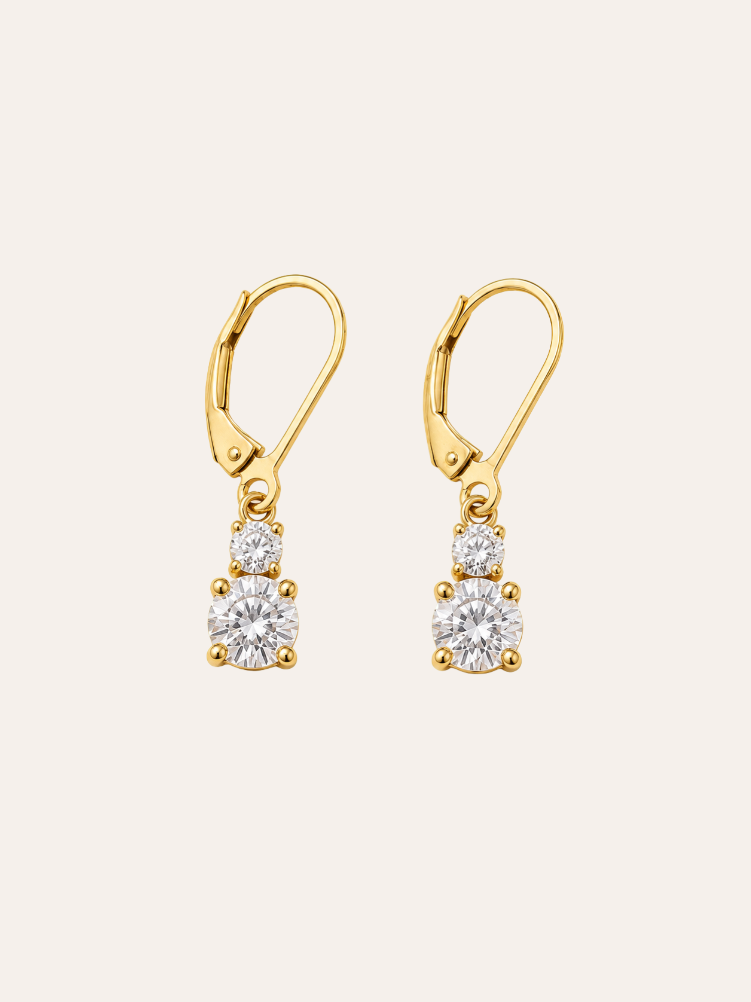 Moissanite Drop Earrings in evening light on dark velvet