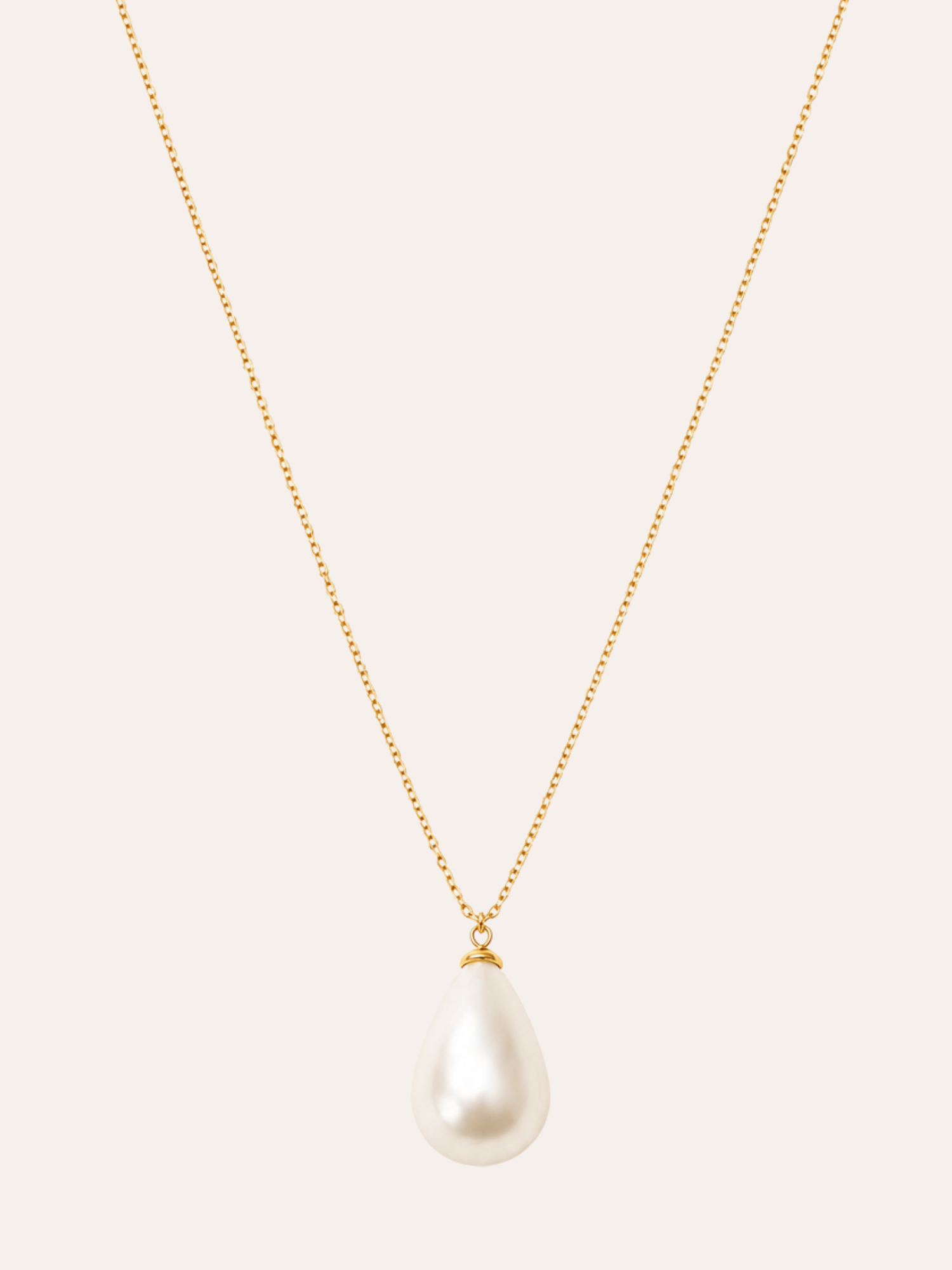 Single Pearl Pendant Necklace in evening light on dark velvet