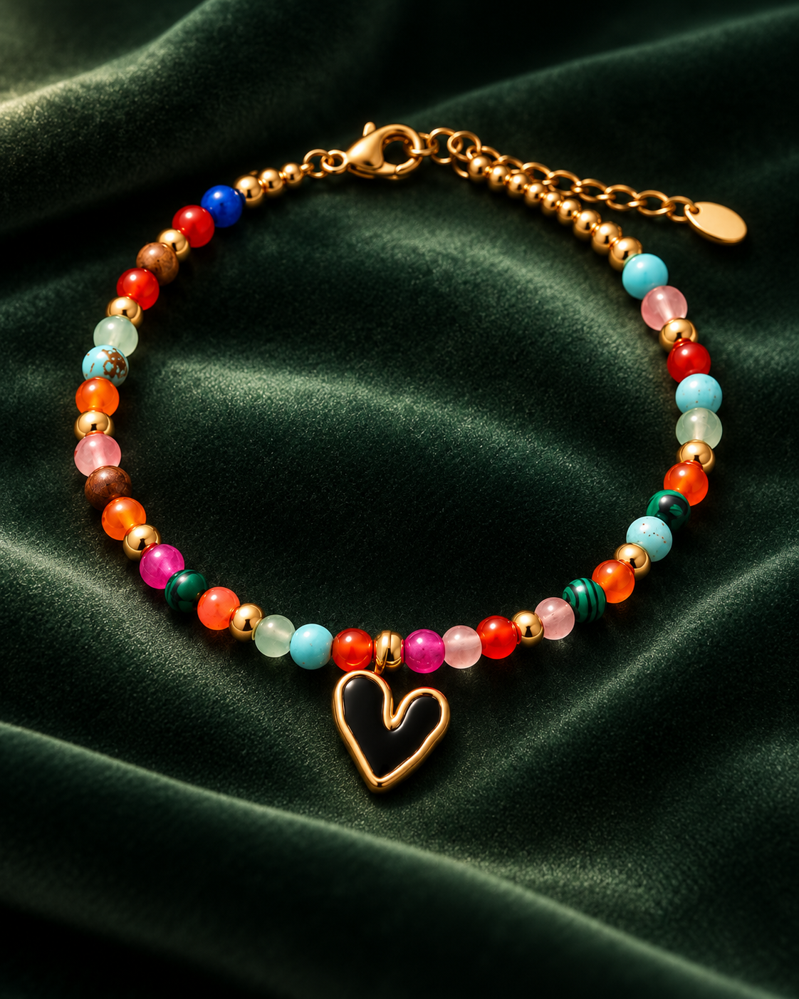 Mosaic Heart Bracelet on deep green velvet with multicoloured beads and black heart charm