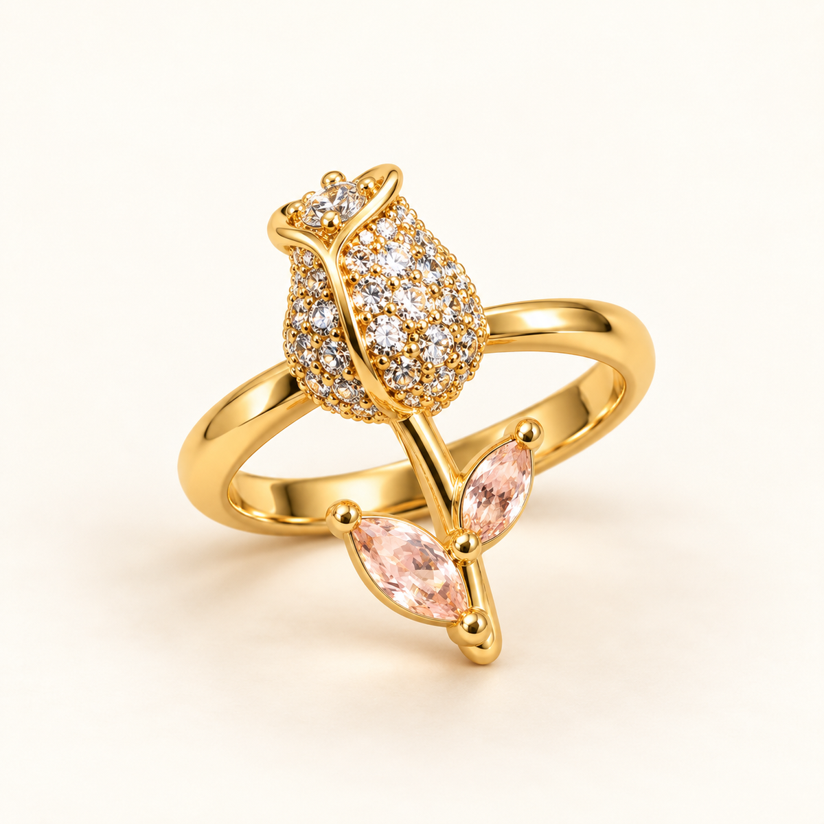 Tulip Ring in gold tone stainless steel, pave set bud with two blush marquise leaves