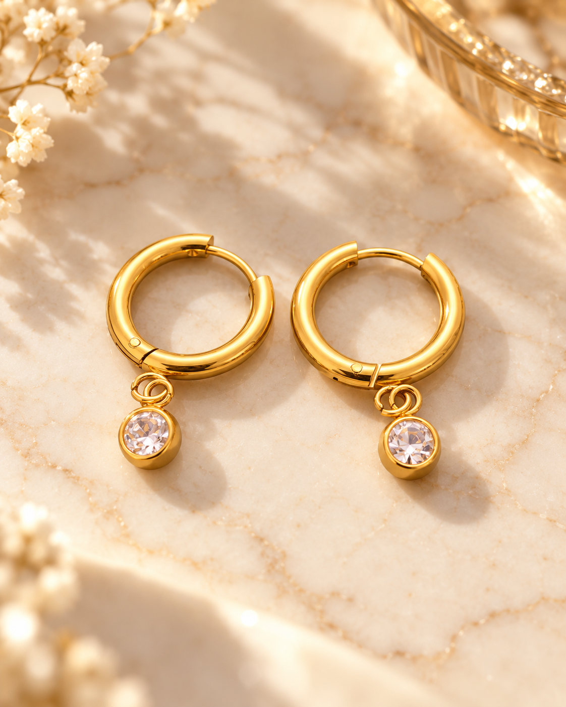 Amaraeth Solitaire Drop Huggie Earrings with clear stone, gold tone