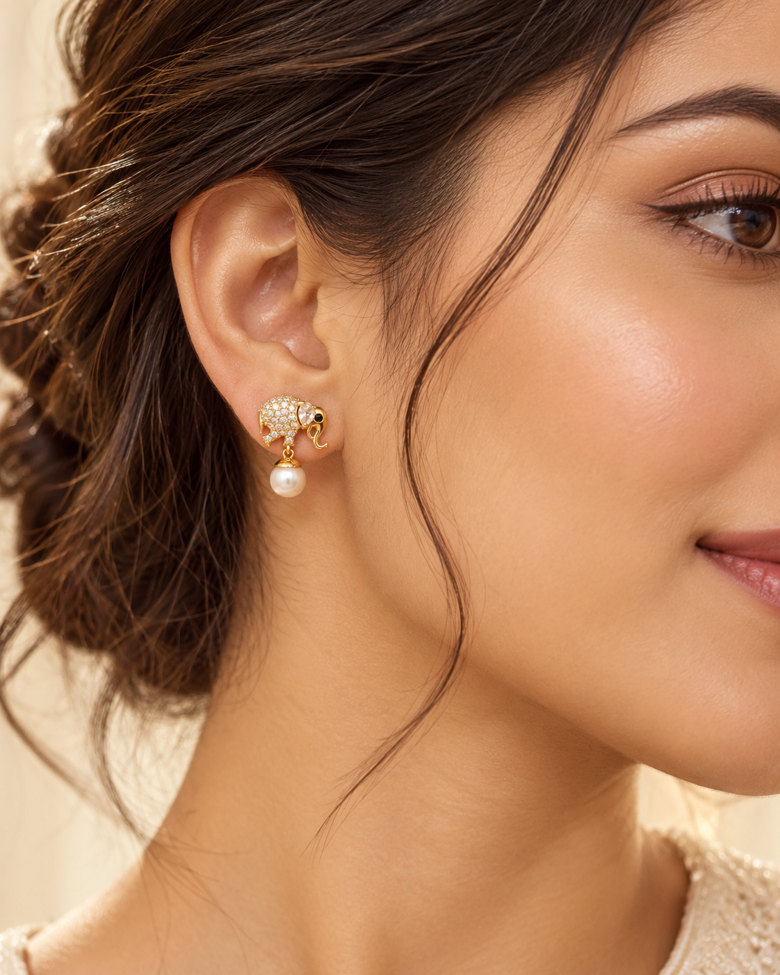 Elephant Drop Earrings, a mirrored pair with pear cut stone ears and black stone eyes