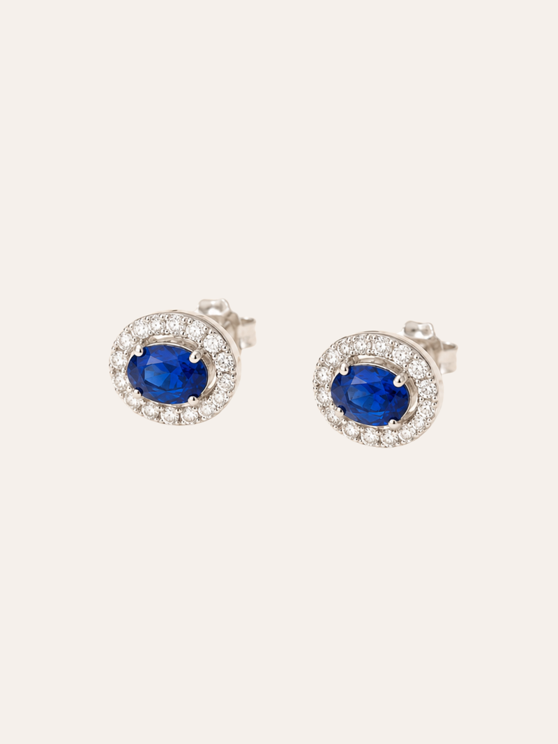 Blue Topaz Halo Stud Earrings in daylight