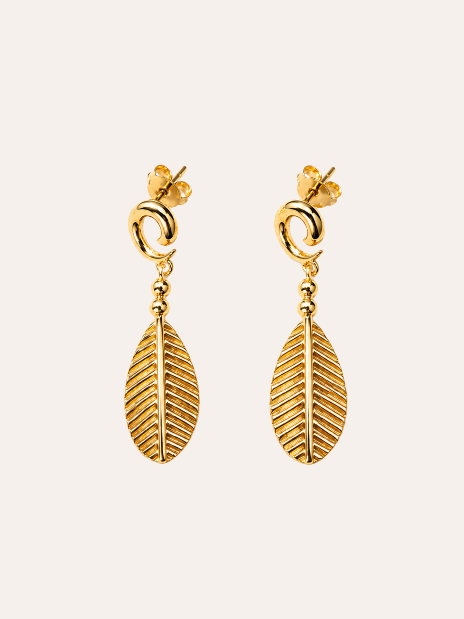 Gold Teardrop Drop Earrings in evening light on dark velvet