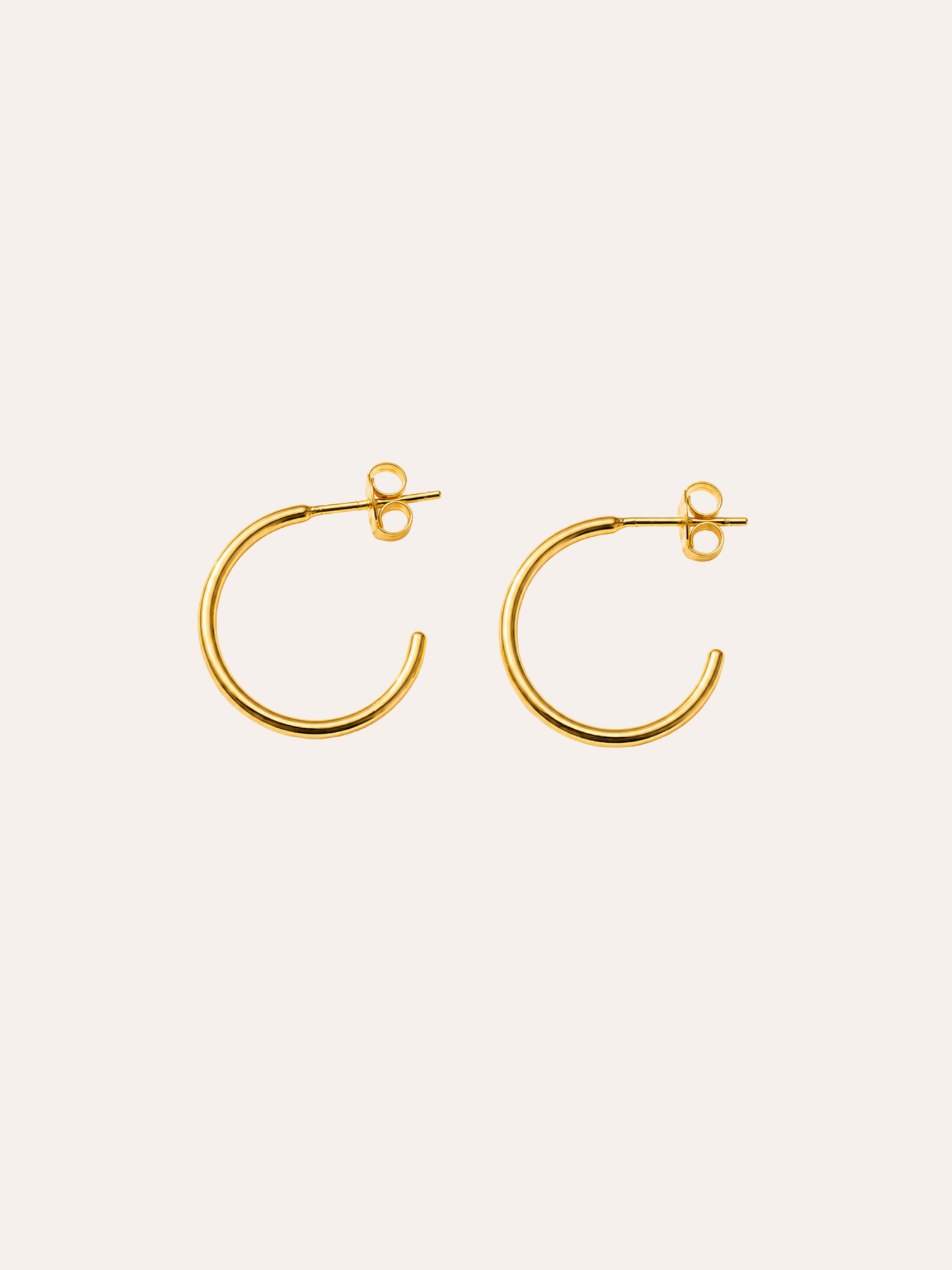 Everyday Gold Hoops in evening light on dark velvet