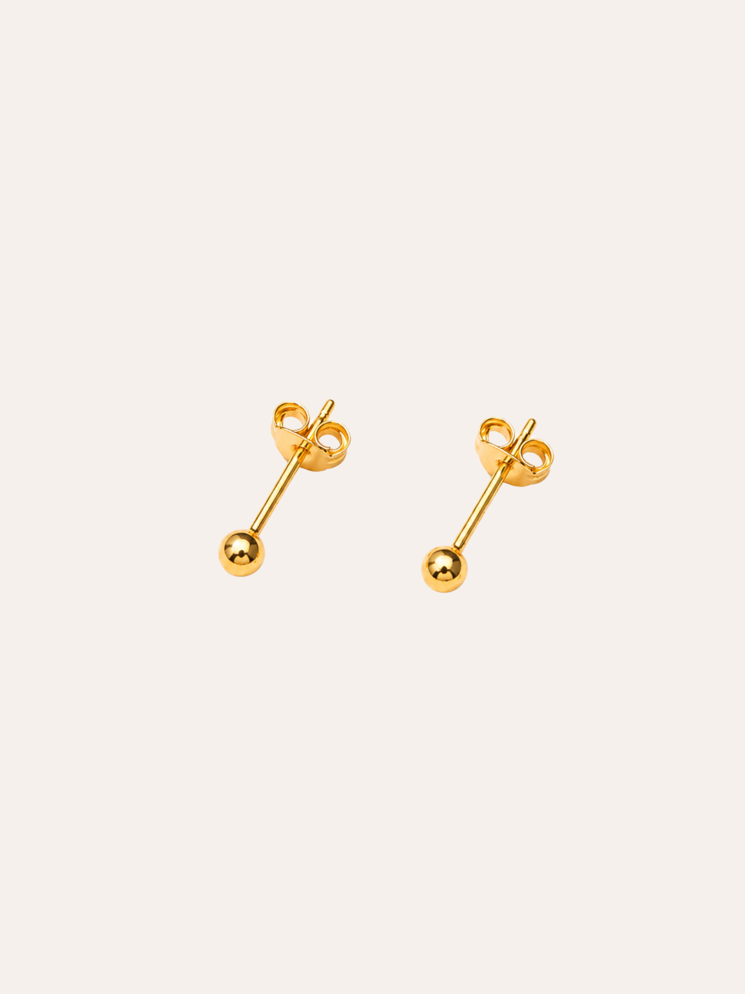 Classic Gold Dome Stud Earrings in evening light on dark velvet