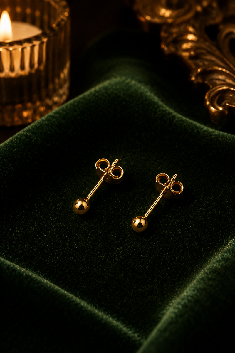 Classic Gold Dome Stud Earrings in evening light