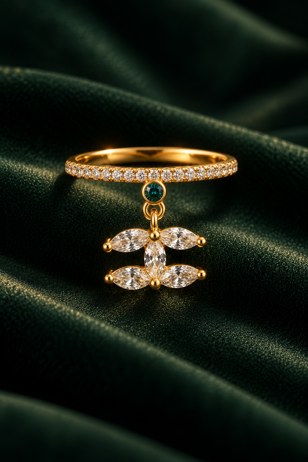 Lotus Drop Ring detail, five marquise stones forming a hanging lotus below a green bezel