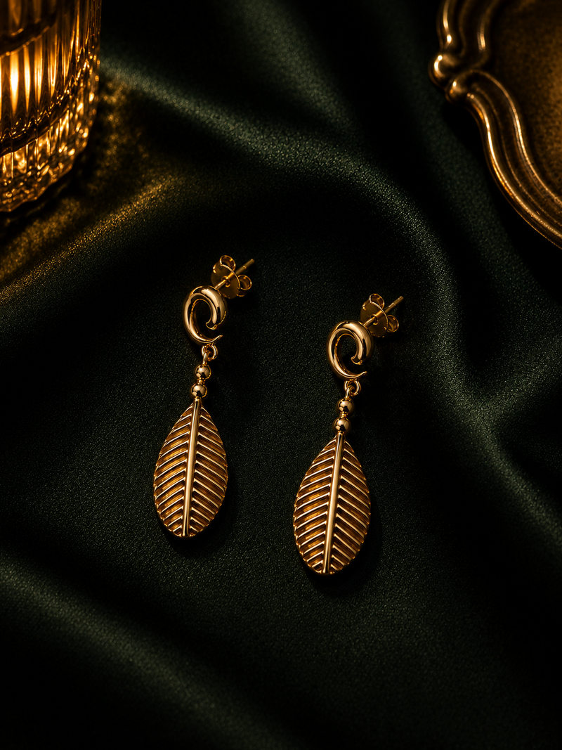 Gold Teardrop Drop Earrings in evening light
