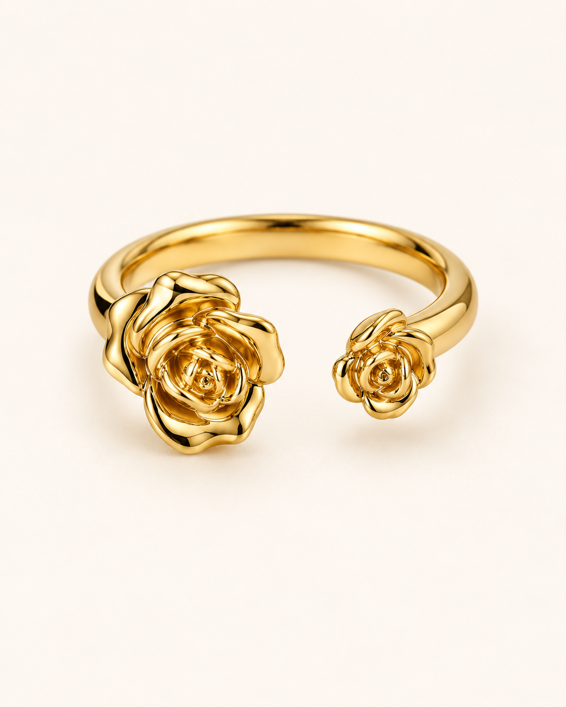 Two Roses Ring, open gold tone stainless steel band with a large and a small rose
